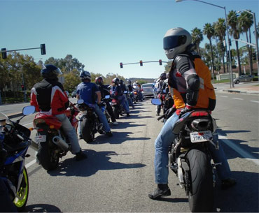 Motorcycle Rider looking backwords at the camera